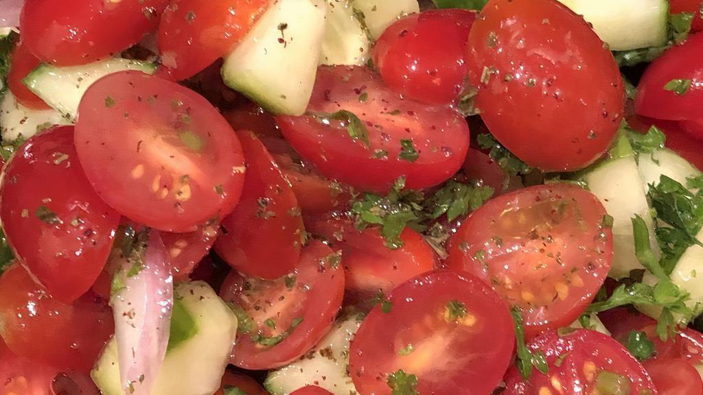 Israeli Salad · Vegan, vegetarian, gluten-free. Tomato, cucumber, red onion, parsley, fresh mint, fresh lemon & olive oil dressing.