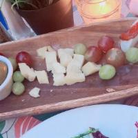 Mixed Cheese Board · Mozzarella, parmesan, provolone, smoked mozzarella with fruits, roasted peppers and salami