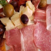 Antipasto Toscana · Fresh mozzarella, imported cheese, roasted peppers, sundried tomatoes, salami and prosciutto.