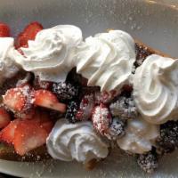Mixed Berry French Toast · Topped with berries, whipped cream and powdered sugar.