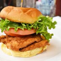 Crispy Chicken Sandwich · Top menu item. Seasoned fried chicken breast on a brioche bun with lettuce and tomato.