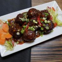 Manchurian · Fried Veg. dumplings, dunked into a sauce that explodes with hot, sweet, and salty flavors