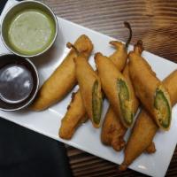 Cut Mirchi · Fresh Green chillies stuffed with chef's special potatoes mixture then fried