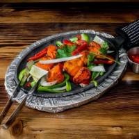 Chicken Tikka · Boneless pieces of chicken marinated overnight and cooked in a Tandoor