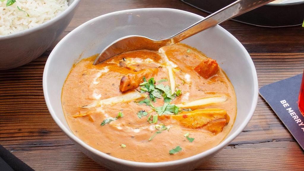 Butter Chicken · Flavorful Chicken cooked in a mild buttery tomato sauce
