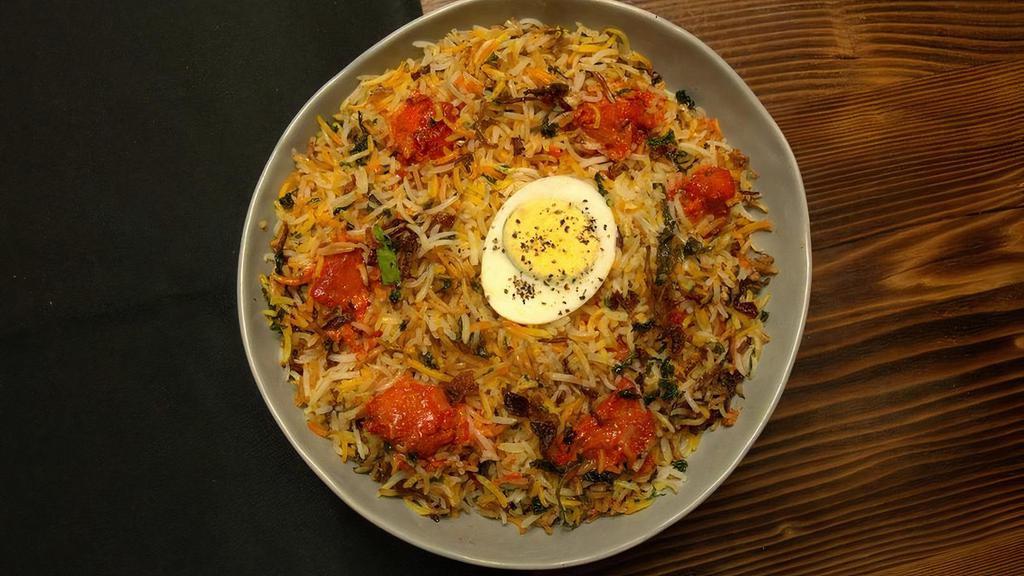Chicken 65 Biryani · Basmati rice layered with boneless spicy fried chicken marinated in ginger, lemon, & a selection of fresh spices