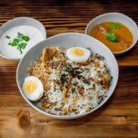 Hyderabadi Chicken Biryani · Succulent Pieces of Chicken Marinated Overnight with Special Herbs and spices then cooked wi...