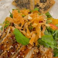 Warm Asian Glazed Chicken · organic baby greens, julienne vegetables, crisp wontons, mandarin oranges, toasted almonds, ...
