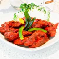 Murgh Malova · Chicken marinated in apple cider vinegar, ground pepper, curry leaves, in a fiery red chili ...