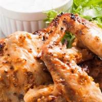 Honey Mustard Wings · Fresh batch of crispy chicken wings tossed in honey mustard and served with a side of ranch.