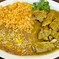 Costillas En Salsa Verde · Ribs dressed in tomatillo sauce, served with tortillas, rice and beans.
