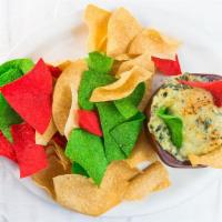 Spinach & Artichoke Dip · With tri color tortilla chips.