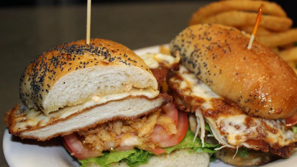 Crispy Chicken Sandwich · Breaded chicken cutlet, lettuce, tomato, crispy onion, mozzarella cheese and chipotle aioli on garlic bread