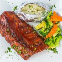 Fork & Knife Ribs · Fall off the bone rack of ribs with smoky BBQ sauce.