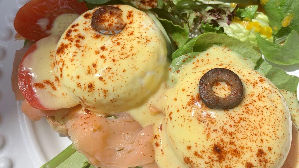 Smoked Salmon Benedict · English muffin, fresh local poached eggs, smoked salmon, organic baby spinach, tomato, hollandaise sauce. Served with one side dish.