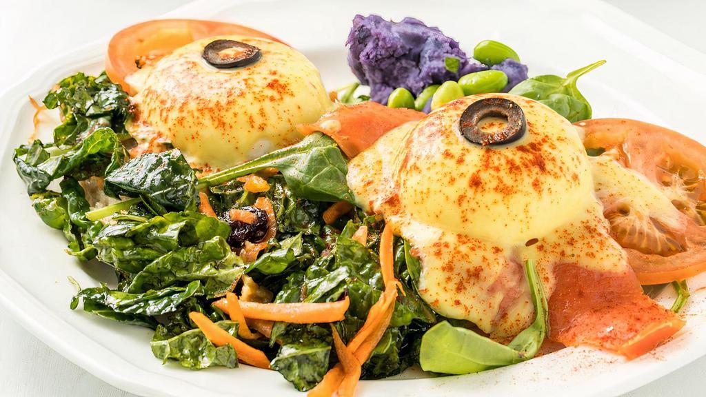Organic Kale Benedict · Vegetarian. English muffin, organic marinated kale, fresh local poached eggs, organic spinach, tomato, hollandaise sauce. Served with one side dish.