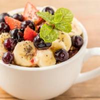Açaí Bowl · Organic acai topped with granola, banana, strawberry, blueberries, honey, and mint