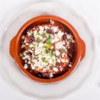 Ntakos · Greek bruschetta olive oil, shredded tomato, oregano, onion and feta cheese, on a crisp rye ...