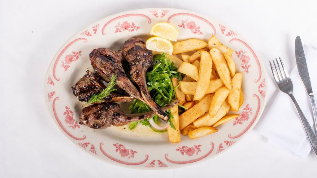 Paidakia (Veal Chops) · Charcoal grilled baby veal chops, served with Greek style fresh cut fries.