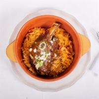 Giouvetsi Arni · Baby lamb shank oven-baked with orzo and fresh tomato sauce.