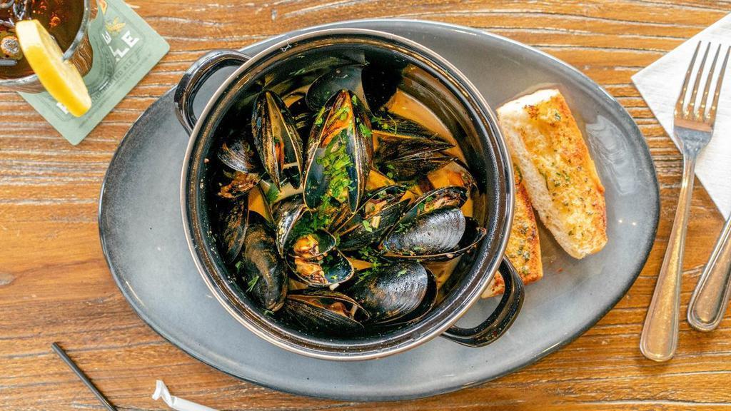 -Pei Mussels · White Wine, Shallot, and Dijon steamed Mussels with Garlic Bread.