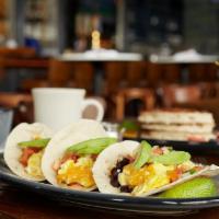 -Texas Breakfast Tacos · Cheesy scrambled eggs, black bean salsa, pico de gallo and sliced avocado.