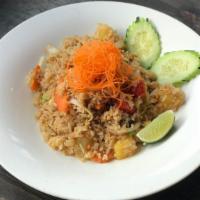 Pineapple Fried Rice · Fried rice with roasted cashew nuts, onion, scallion, tomatoes, pineapple chunks and egg.