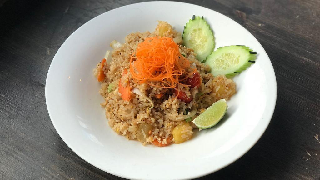 Pineapple Fried Rice · Fried rice with roasted cashew nuts, onion, scallion, tomatoes, pineapple chunks and egg.