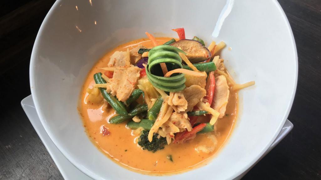 Red Curry · Smooth creamy coconut milk with hot red chili paste, eggplants, bamboo shoots, string beans, basil, carrots and bell peppers.
