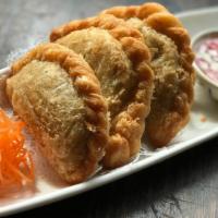 Curry Puff · Combination of chicken, potatoes and onions with curry powder in a puff pastry served with a...