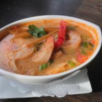 Tom Yum Soup · Spiced and sour soup with mushrooms, lemon grass, chili and kaffir lime leaves.