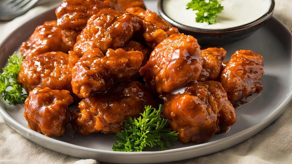 The Buffalo Chicken Wings · Jumbo sized chicken wings smothered in spicy buffalo sauce.