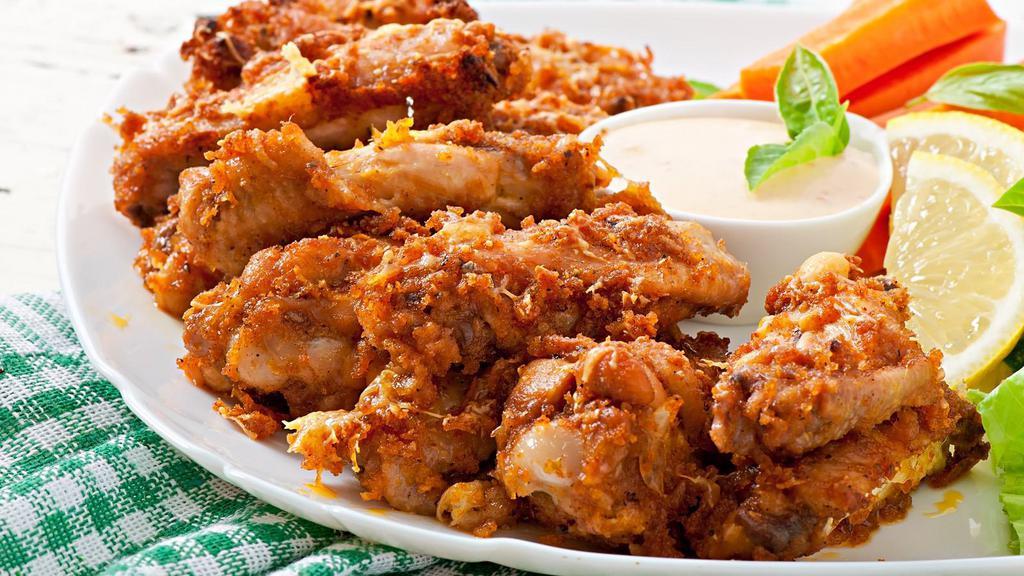 The Garlic Parmesan Chicken Wings · Classic garlic parmesan flavored jumbo sized chicken wings crisp to perfection.