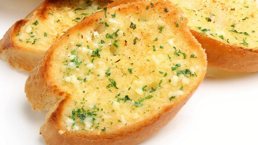 Garlic Bread · Fluffy loaf bread garnished in butter, parmesan cheese & garlic.
Sure to delight!