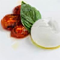Caprese · Mozzarella di Bufala, roasted tomatoes, basil.