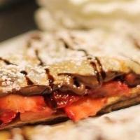 Chocolate Covered Crêpe · Nutella and strawberries. All sweet crepes are not served with syrup or whipped cream on top.