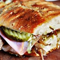 #5 Cuban · Grilled ham, grilled boars head roast pork, melted swiss & american cheese, mayonnaise, lett...