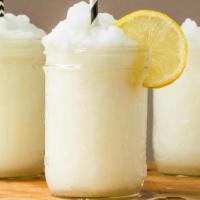 Frozen Lemonade · FRESH SQUEEZED LEMONS , BLENDED WITH ICE AND SUGAR