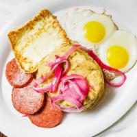 Two Eggs, Tropical Cheese, Salami, And Mangu · Two egg, one slice of tropical cheese, and three salami. mangu los tres golpes huevos un sli...