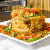 Mofongo With Shrimp · Mashed green plantain with a garlic. Served with sauteed medium size shrimp in seasoned gravy.
