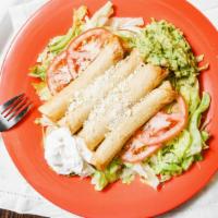 Flautas Chicken · Four pieces of baked chicken rolled up in a corn tortilla deep fried. Served on a bed of let...