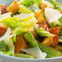 Caesar Salad · Crisp romaine tossed with croutons caesar dressing and grated cheese.
