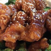 Sesame Chicken · Spicy. Crispy chunks of chicken over broccoli, sweet brown sauce and topped with sesame seeds.