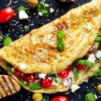 Greek Omelette · Breakfast style eggs with greek olives, tomatoes, onions, and feta cheese.