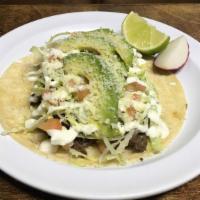 Tacos Gringo · Corn tortilla topped with your choice of meat, avocado, lettuce, tomato, sour cream, and gra...