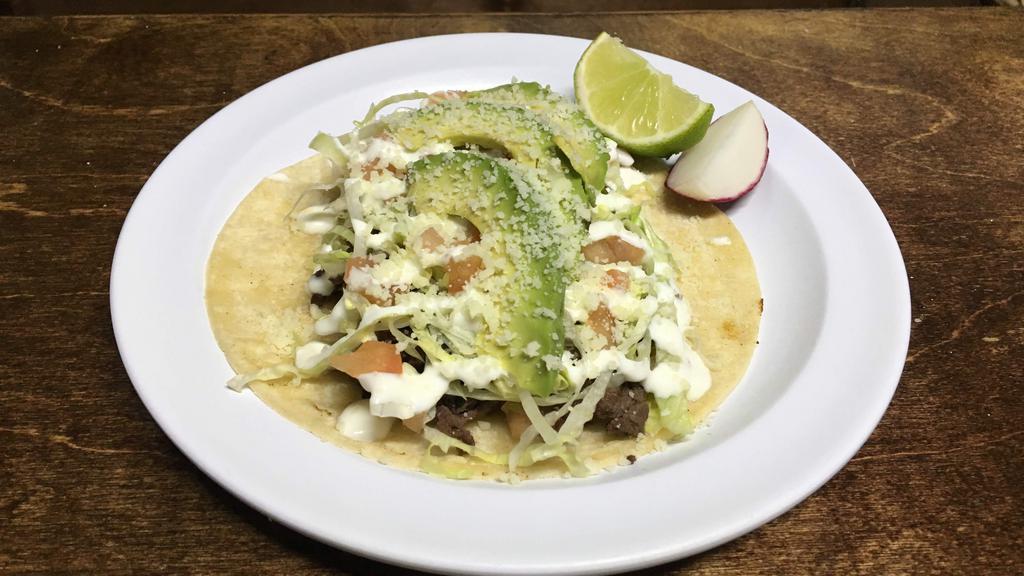 Tacos Gringo · Corn tortilla topped with your choice of meat, avocado, lettuce, tomato, sour cream, and grated cotija cheese. Salsa on the side.