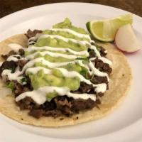 Tacos Tex · Corn tortilla topped with your choice of meat, guacamole, onions, cilantro and sour cream. S...