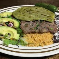 Carne Asada Con Nopales · Carne asada con arroz, frijoles, ensalada, nopale y four tortillas. (Grilled steak served wi...