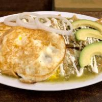Chilaquiles · Corn tortilla chips, topped with green or red salsa, sour cream, cheese, onions, and avocado...