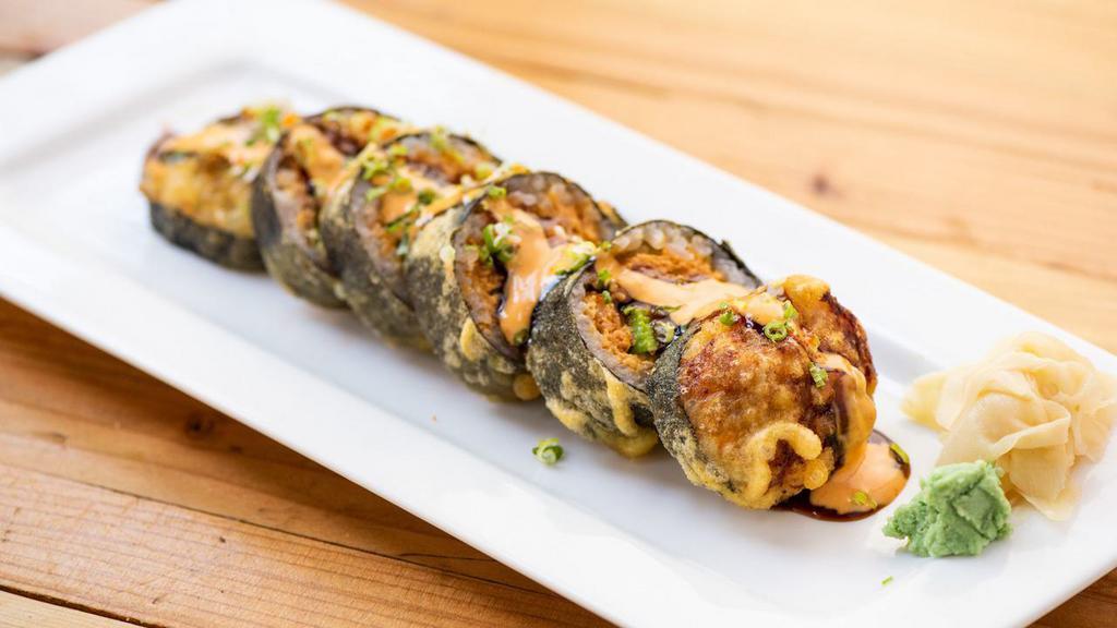 Godzilla Roll · Spicy tuna, avocado, and cream cheese inside, deep-fried on top with eel sauce and spicy mayonnaise.